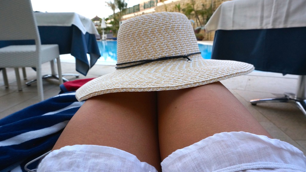 wide brimmed hat at the pool at the Sea Palace Hotel Cefalu