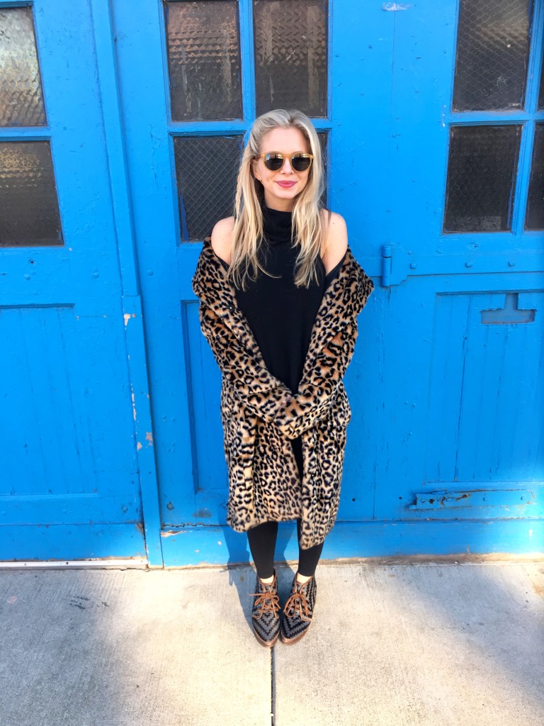 black sleeveless turtleneck sweater, leopard faux fur coat, chevron shoes